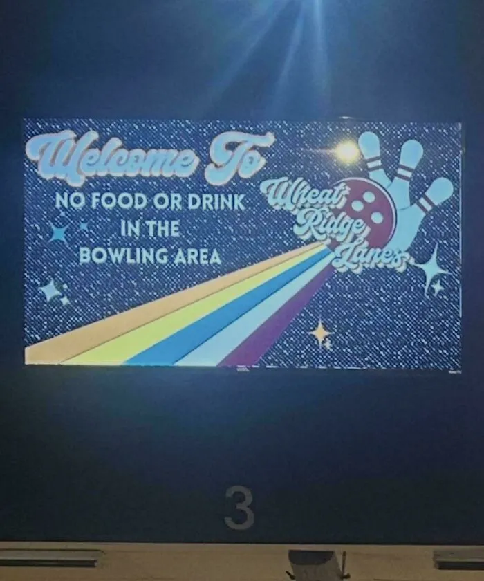 A badly designed sign at Wheat Ridge Lanes with confusing rules and layout.