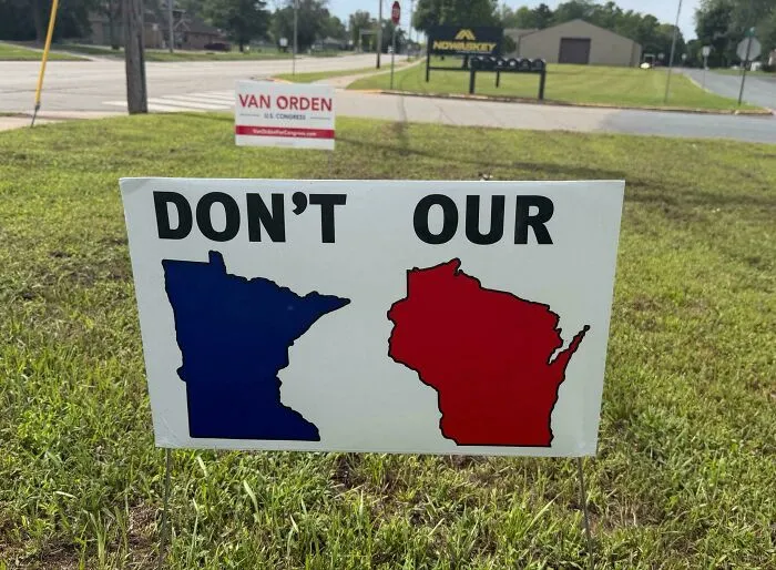 Lawn political sign with confusing layout representing badly designed signs.