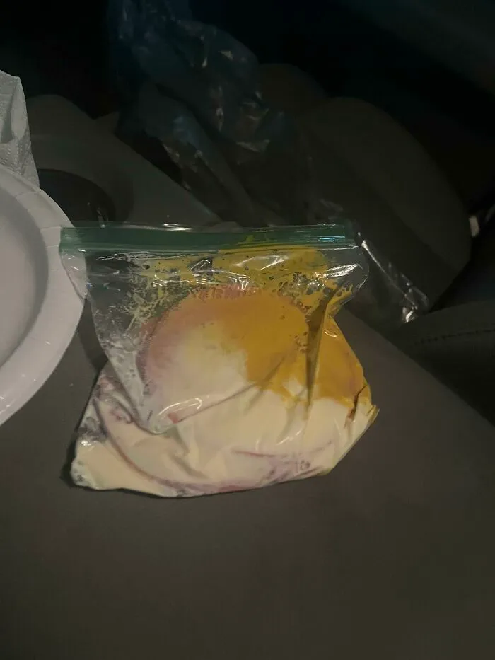 A plastic Ziploc bag containing a messy mixture of mustard and mayonnaise, showing things wives do.
