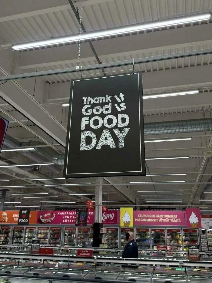Grocery store hanging banner showcasing hilarious badly designed signs with jumbled text about food day.