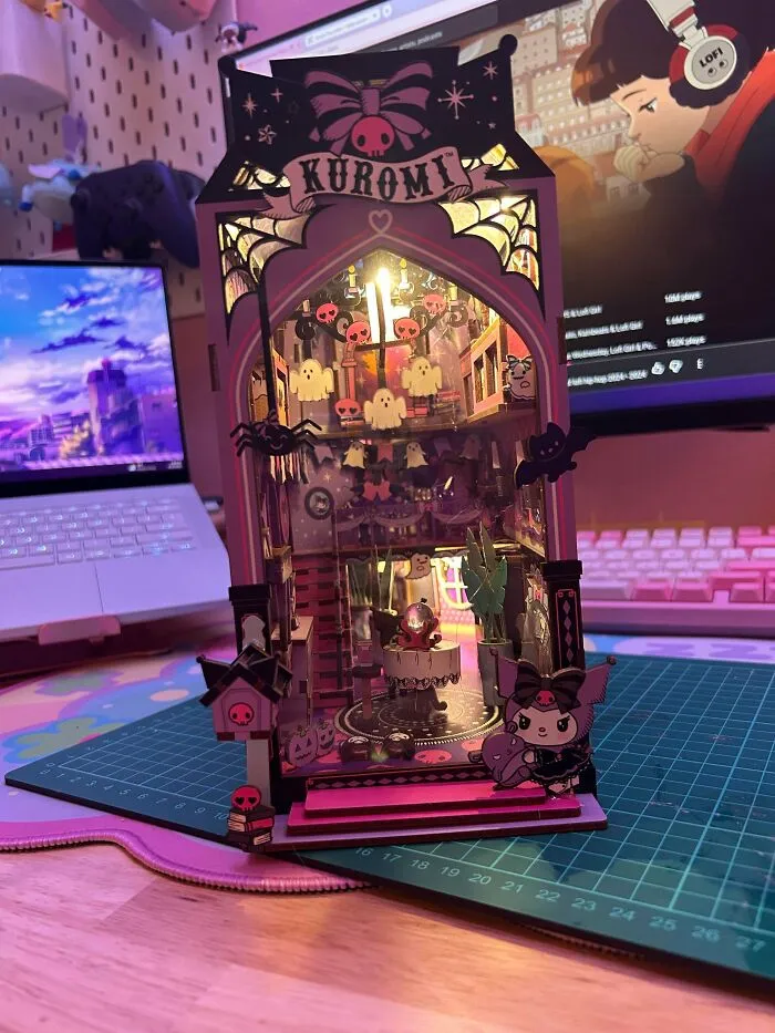 Spooky Kuromi themed miniature book nook kit with pink lights, ghosts, and bats decorations