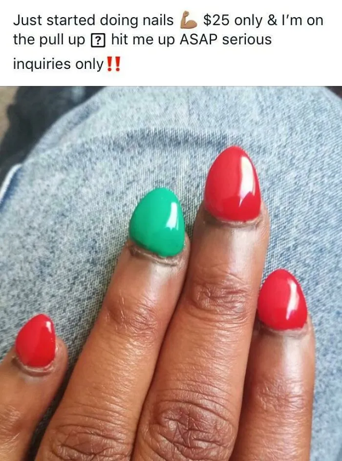 A close-up of a hand with poorly applied red and green acrylic nails, showcasing classic beauty procedures fails.