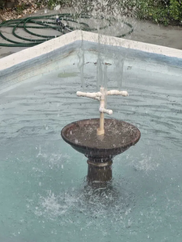 A homemade water fountain constructed with PVC pipes showcasing creative DIY projects.