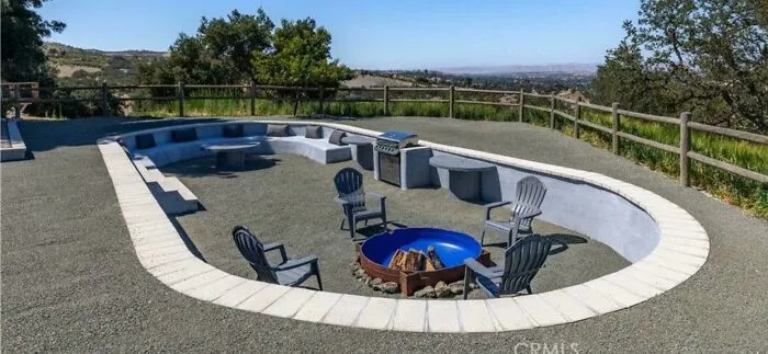 An outdoor seating pit and fire pit area built into the ground, featured in questionable DIY projects.