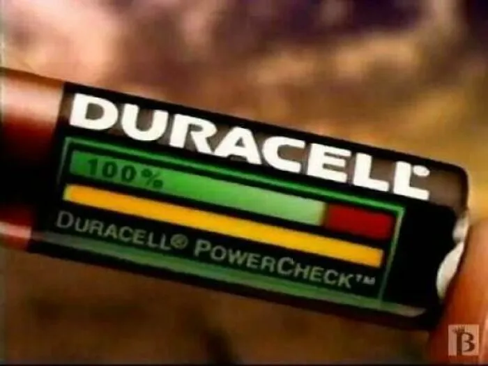 A close-up of a Duracell PowerCheck battery showing its tester strip, popular in the 90s.