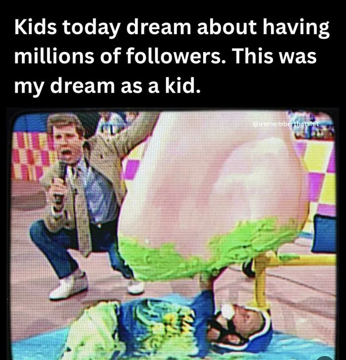 A contestant on a 90s TV game show picking a giant nose filled with green slime