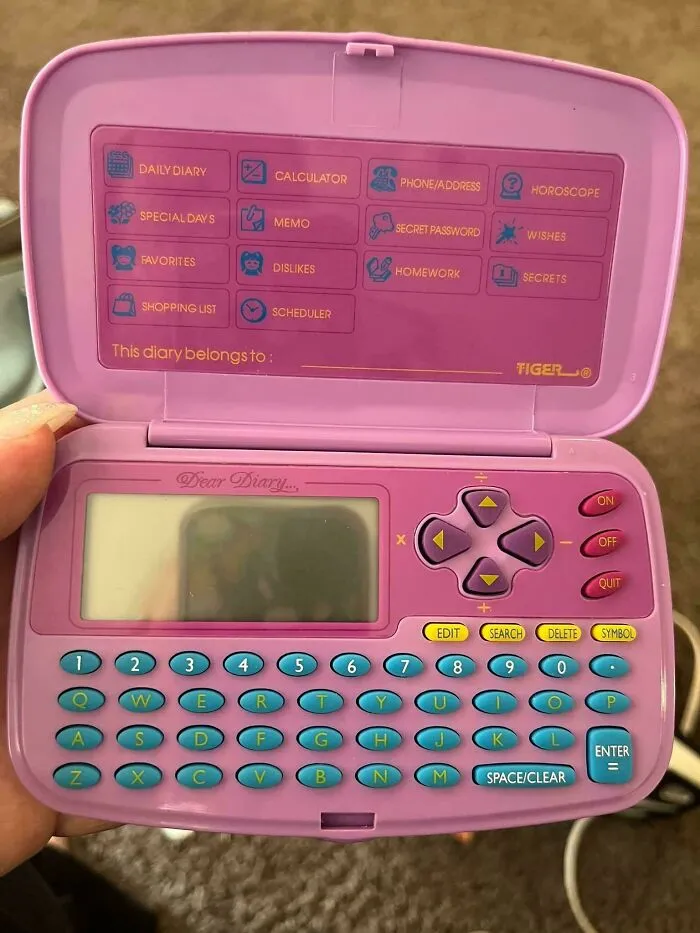 A purple vintage Dear Diary electronic toy by Tiger, a popular girls accessory for 90s entertainment.