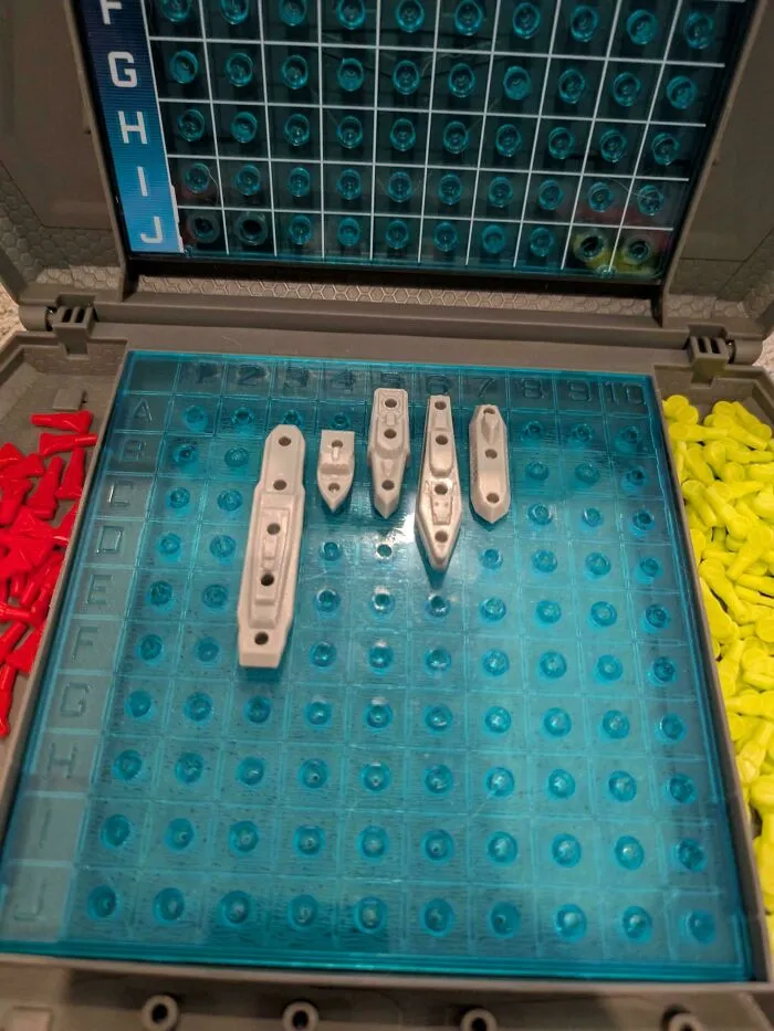A Battleship board game set up for play, showing wholesome dad moments and family fun.