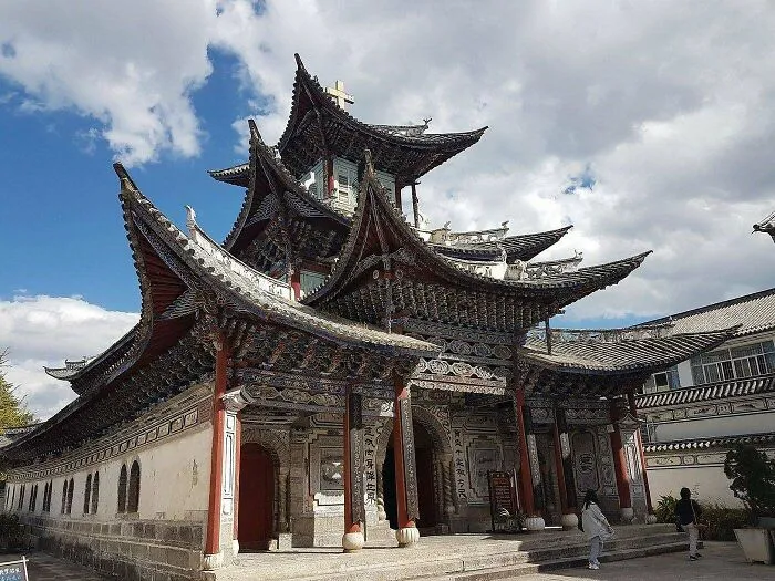 Intricate traditional pagoda featuring architectural masterpieces with detailed multi-tiered roofs and wooden columns