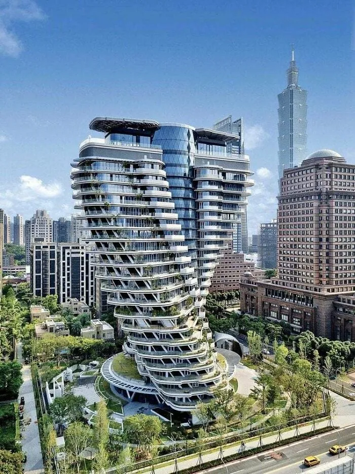 Futuristic twisting skyscraper surrounded by greenery as part of stunning architectural masterpieces in Taipei