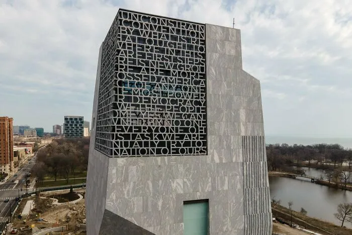 Modern stone building with engraved typography showcasing unique architectural masterpieces design
