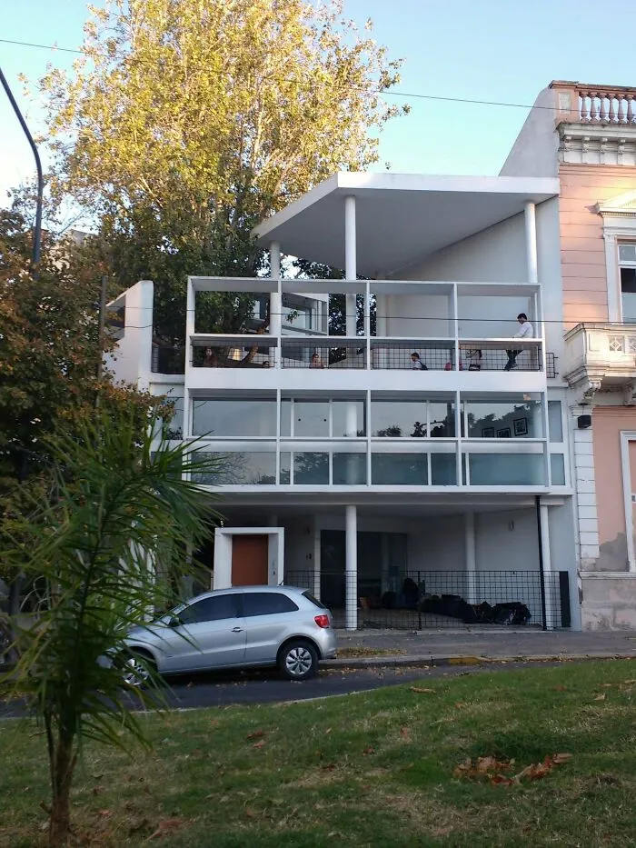 Modernist white building design showcasing unique architectural masterpieces with open balconies and clean lines.