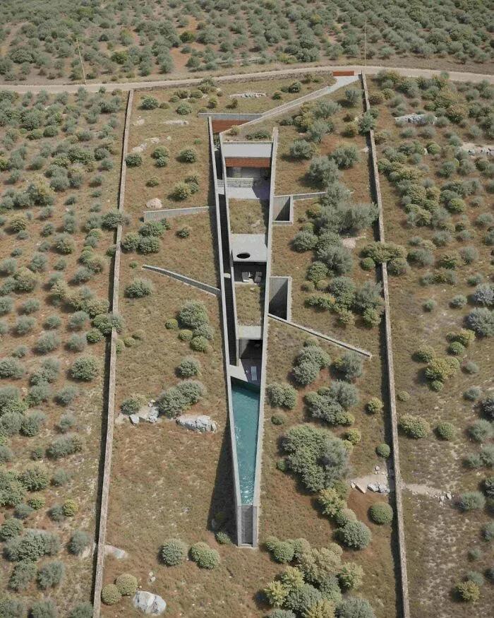 Aerial view of a unique modern subterranean building demonstrating architectural masterpieces integrated into nature.