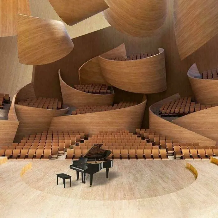Piano on stage inside an auditorium featuring architectural masterpieces made of curved wooden panels.