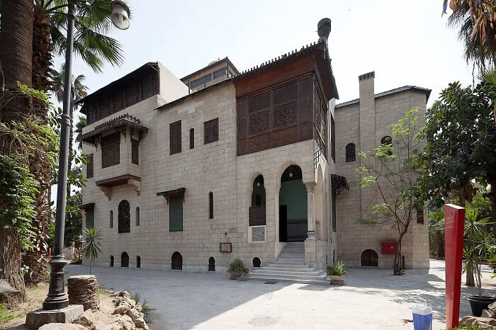Traditional stone building with detailed wooden latticework as architectural masterpieces.