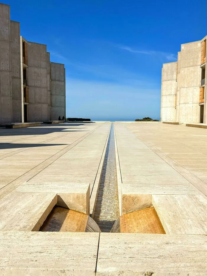 Salk Institute concrete plaza featuring a central water channel as a minimalist architectural masterpiece.