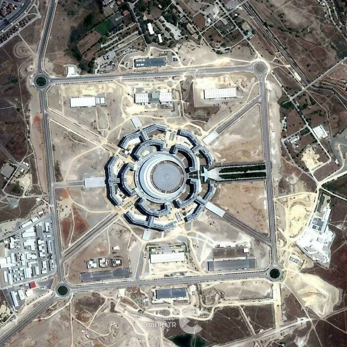 Aerial view of a circular complex showcasing a unique architectural masterpiece layout.
