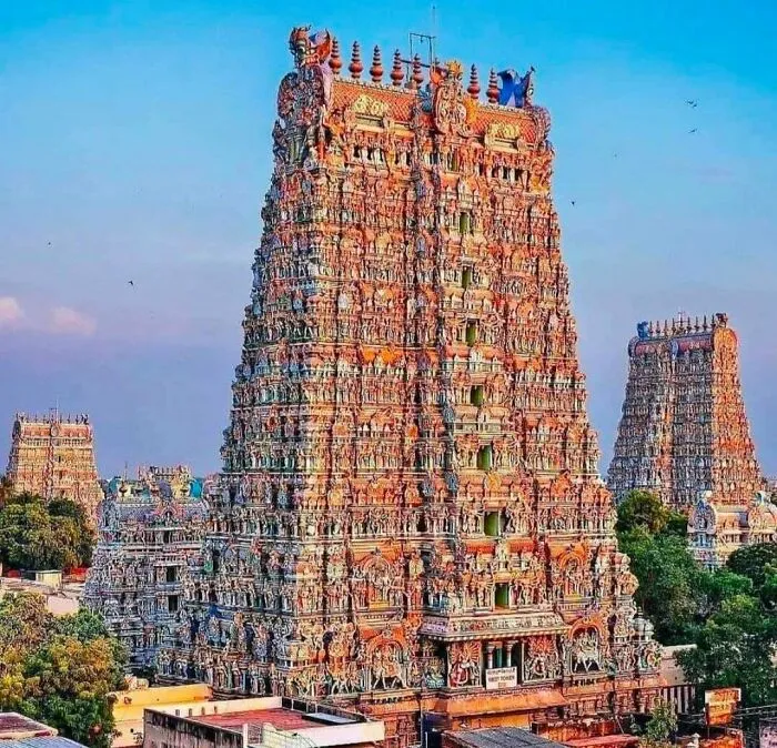 Towering vibrant gopuram of a temple, an ornate architectural masterpiece.