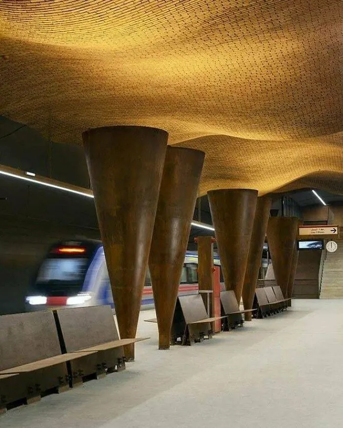 Futuristic train station interior displaying unique architectural masterpieces.