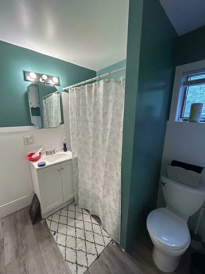 Clean and updated bathroom decor showcasing simple frugal tips for home improvement.