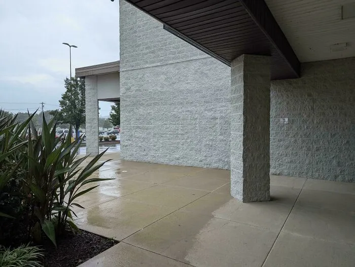 Common Strip Mall Issue. If You Are Going To Provide Protection From The Elements, Why Not Actually Provide Continuous Coverage So That Patrons Can Move Between Businesses Without Getting Wet?