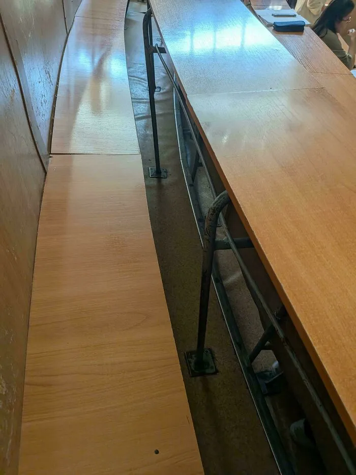 The Gap Between Seat And Rail Is So Narrow, It's Impossible To Pass Through And Sit In The Middle. Same From The Other Side Of The Desk