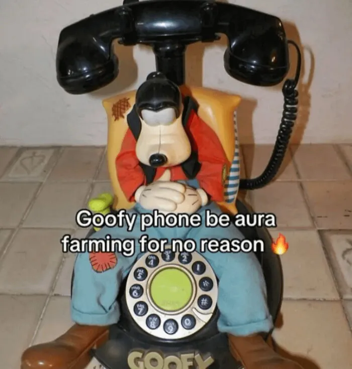 Funny memes showing a vintage Goofy character telephone with a caption about aura farming.