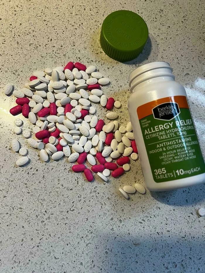 Allergy relief pills spilled on counter showing sheer audacity