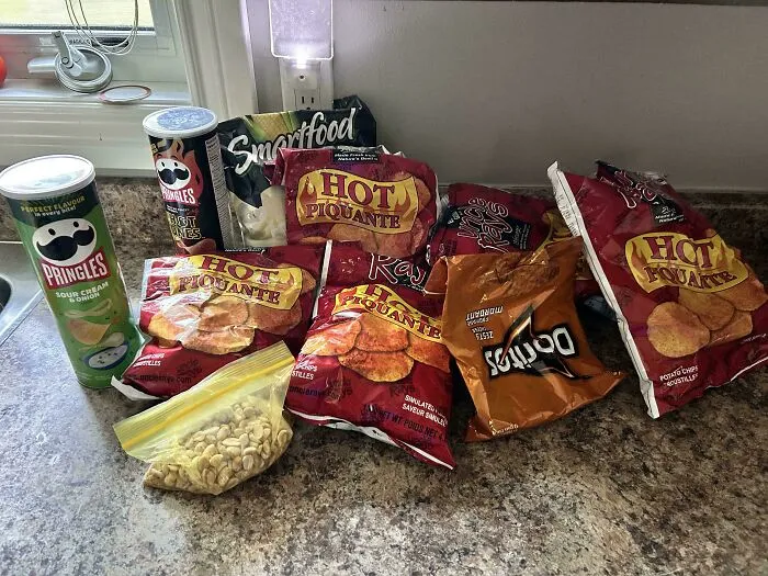 An assortment of snack bags, highlighting the sheer audacity of someone opening multiple chips simultaneously.
