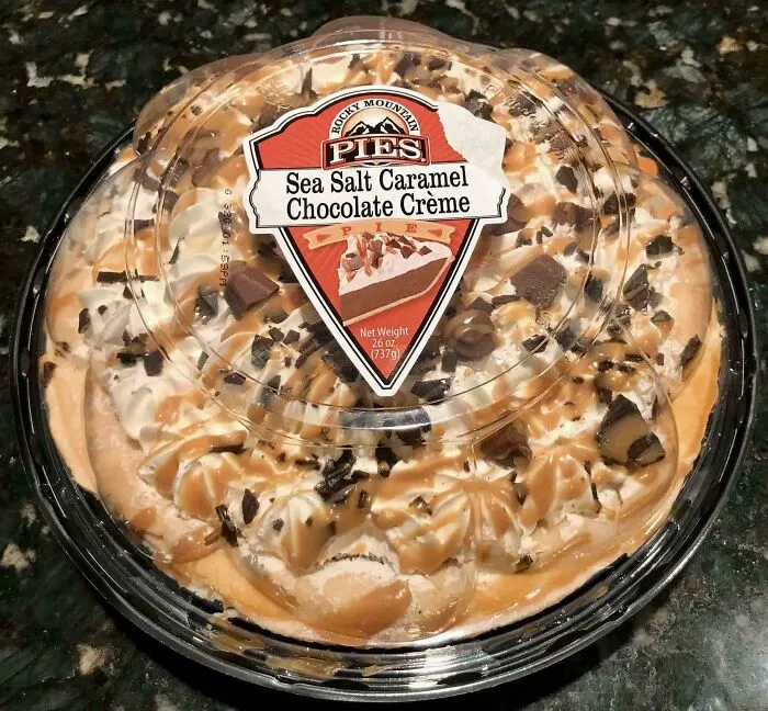 A packaged Sea Salt Caramel Chocolate Crème pie showcasing the audacity of someone eating only the toppings.