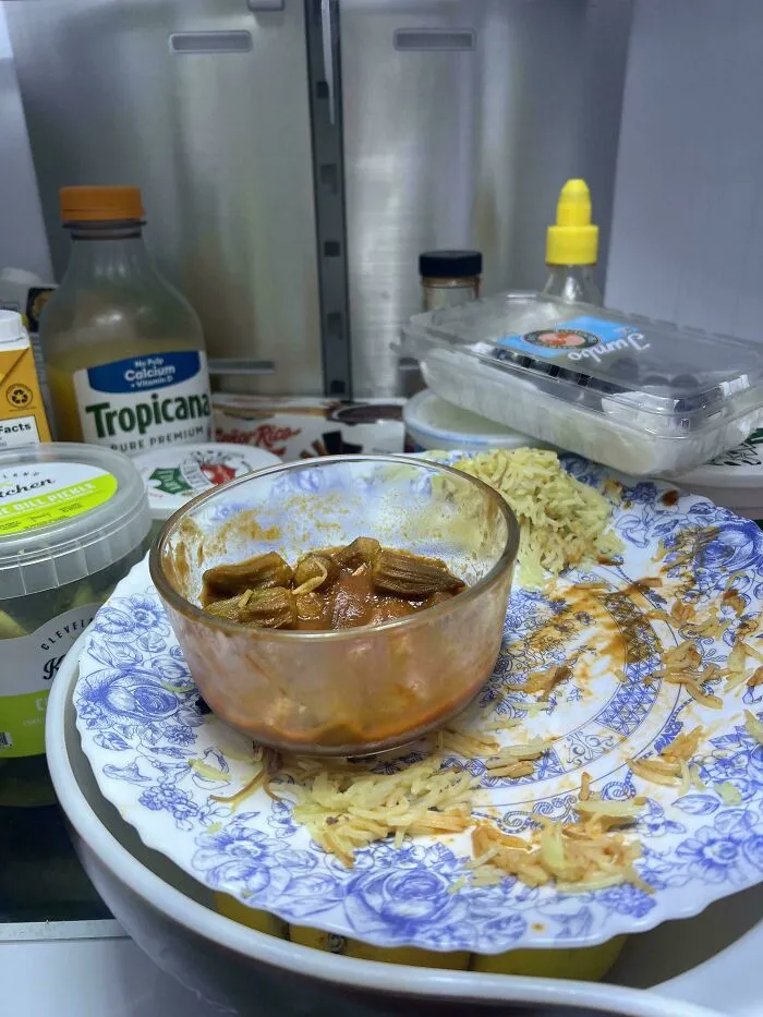 Leftover food on a floral plate left in the fridge, showcasing low effort cleaning