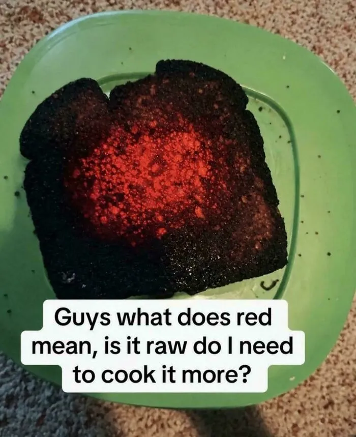 Funny memes of a piece of toast so burnt that the center is glowing red hot like lava