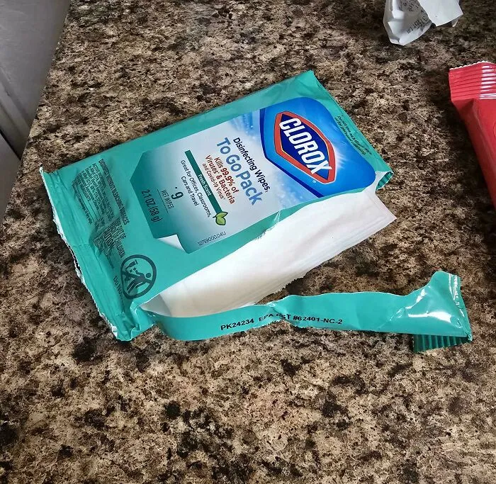 A torn packet of Clorox wipes sitting open, capturing the sheer audacity of careless packaging use