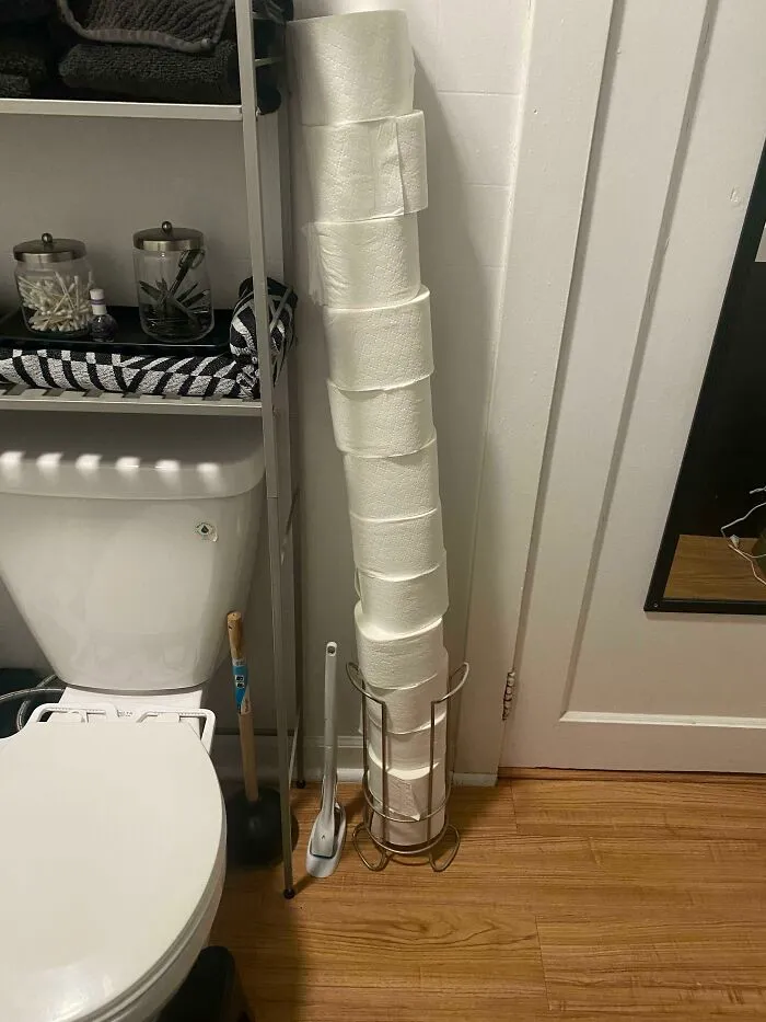 A towering stack of toilet paper showing the audacity of some men who refuse to restock properly
