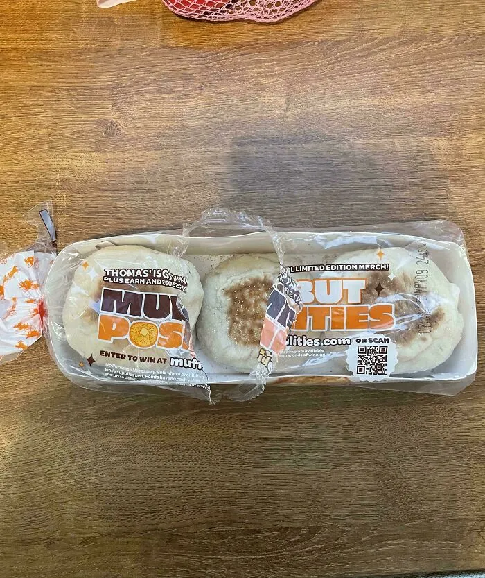 An opened pack of Thomas English muffins on a wooden table, showing audacity some men bring
