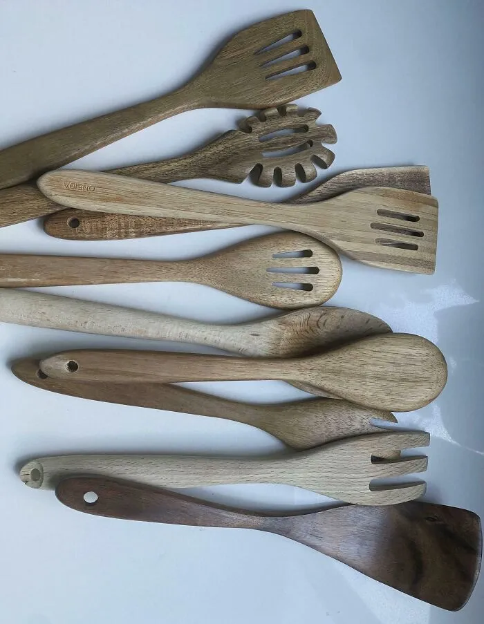 A collection of mismatched wooden utensils, capturing the sheer audacity of how some men organize things