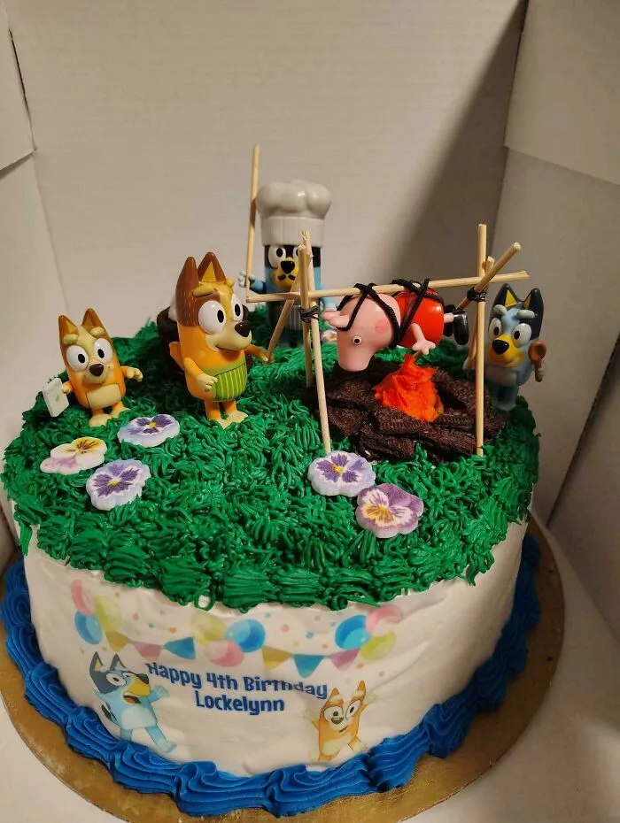 A birthday cake with Bluey figures roasting Peppa Pig, one of many creations awful to look at but well made.