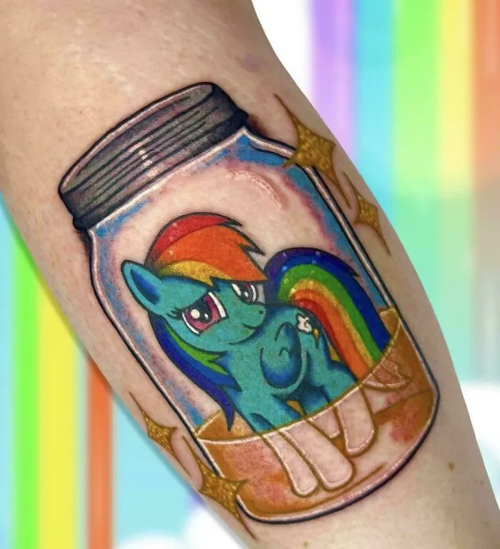 A colorful tattoo of Rainbow Dash inside a glass mason jar, showcasing well-made creations.