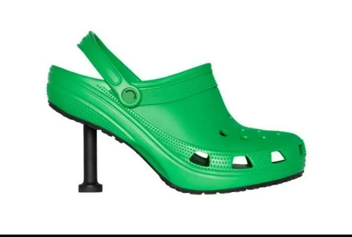 Awful creations showing a bright green high-heeled clog shoe designed by Balenciaga.