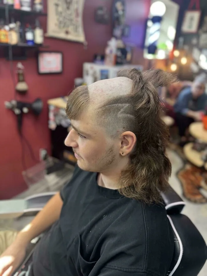 Well-made creations featuring a man with an unusual haircut combining a shaved crown bangs and a mullet