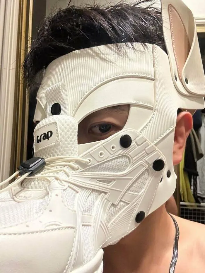 Futuristic sneaker mask worn on face as one of the creations awful to look at.