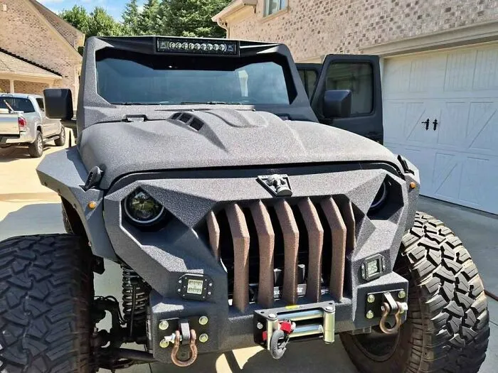 Well-made but awful creations featuring a heavily customized textured off-road vehicle with an aggressive front grille