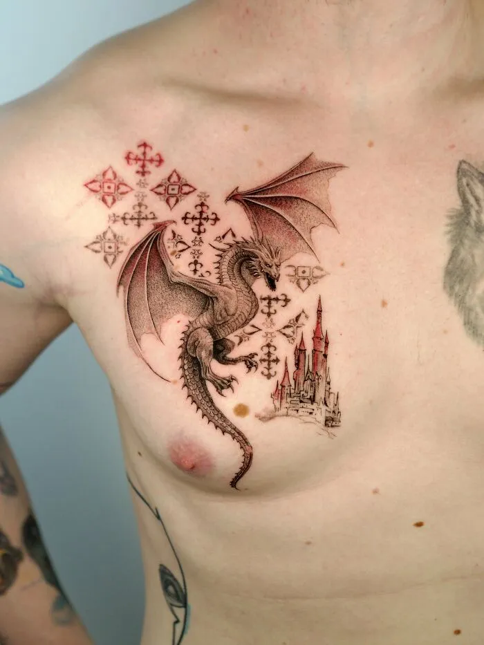Dragon and castle tattoo in nature ink on chest