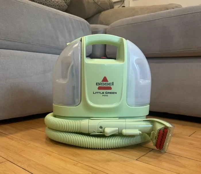 A green Bissell Little Green Mini carpet cleaner, featured in Prime Big Deal Days recommendations.