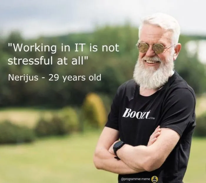 Older man smiling with text about IT job stress for programmers meme