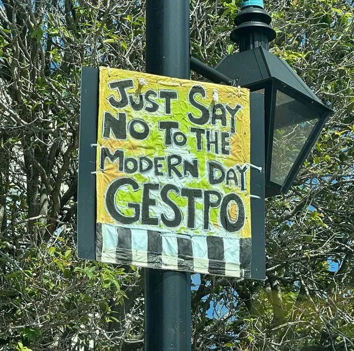 An outdoor protest sign showing a hand-drawn spelling and grammar fail.