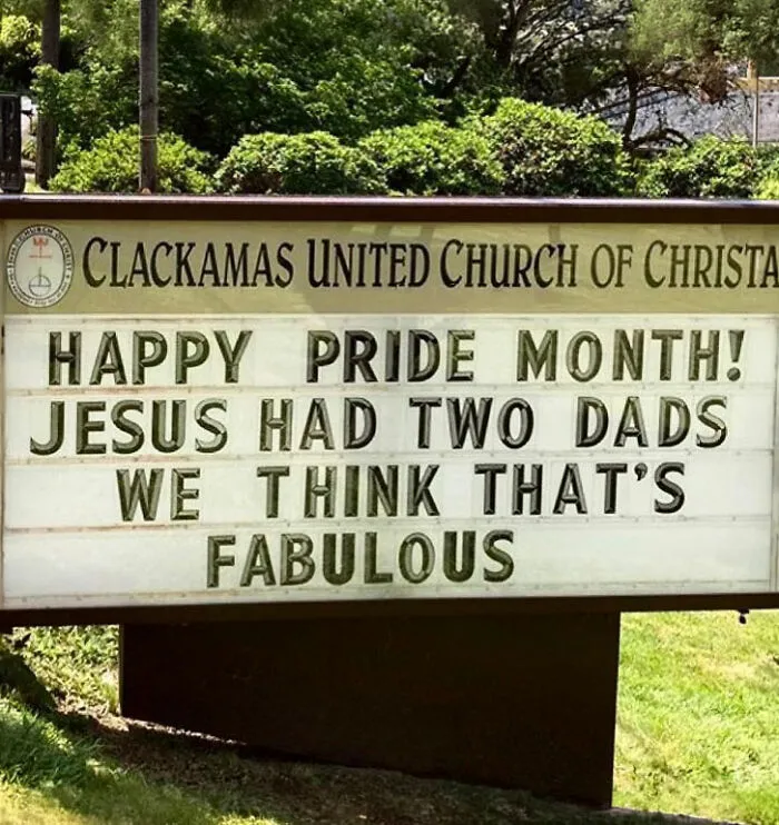 Church sign humorously celebrating Pride Month with Jesus having two dads