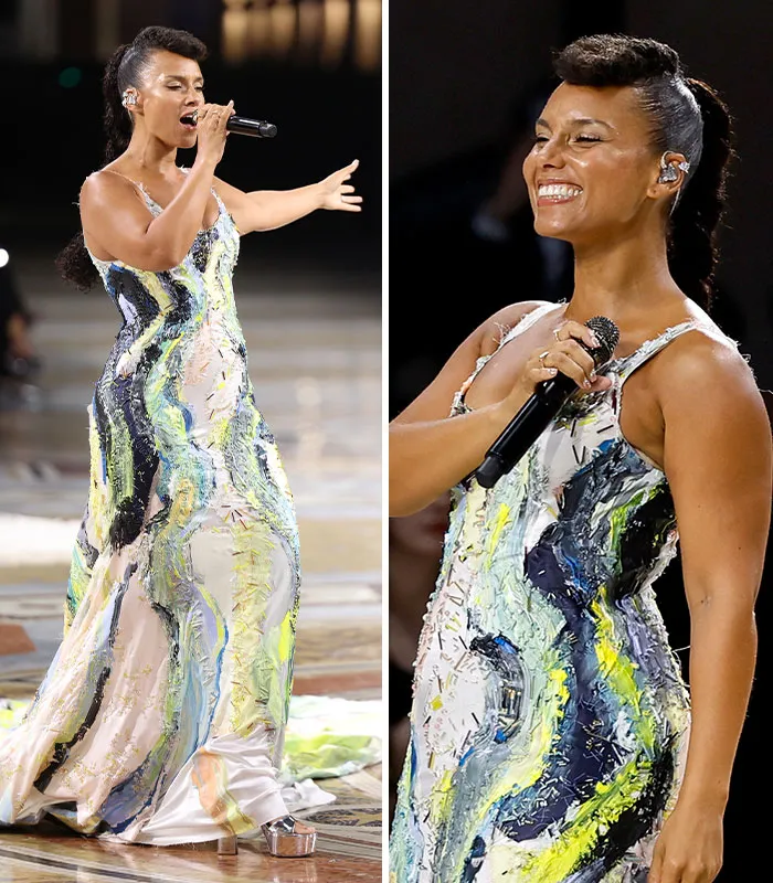 Celebrity performing in colorful abstract dress at Plastic Surgery Expo