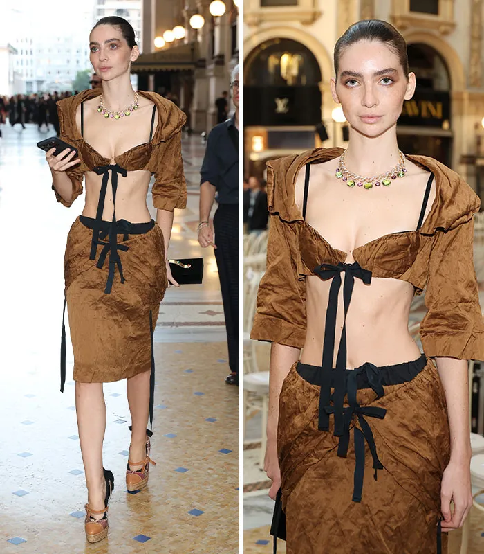 Model in brown cropped top and skirt combo at plastic surgery expo