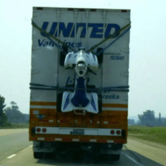 Moving fails image of United Van Lines truck with motorcycle strapped to rear door